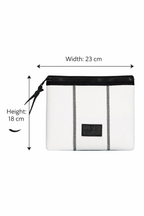 White pouch with black zipper and strap on a white background