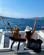 Two people on a boat with scenic ocean view